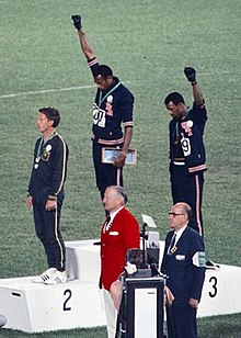 220px-John_Carlos,_Tommie_Smith,_Peter_Norman_1968cr.jpg