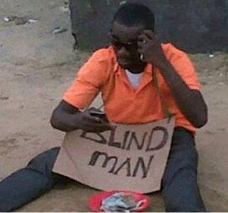 Blind Man Asking for Money Reads Blackberry 1360845454.jpg