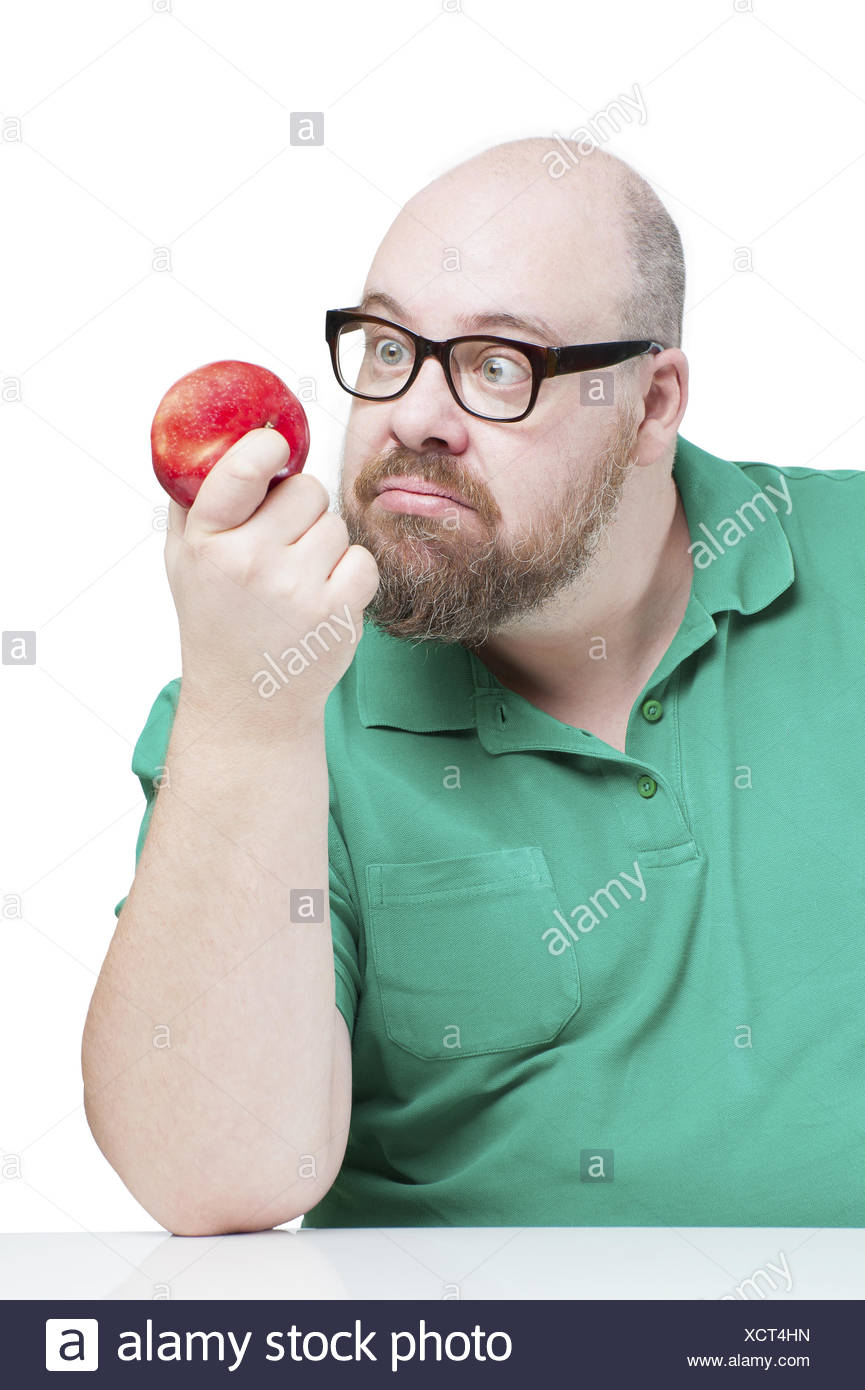 funny-man-stares-at-a-red-apple-XCT4HN.jpg