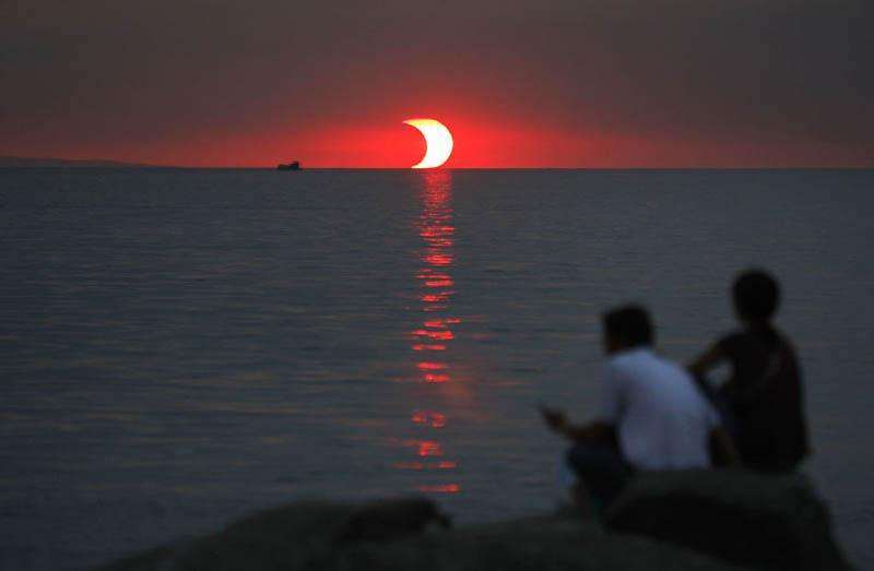 This is what it looks like when a sunset and an eclipse happen at the same time.jpg