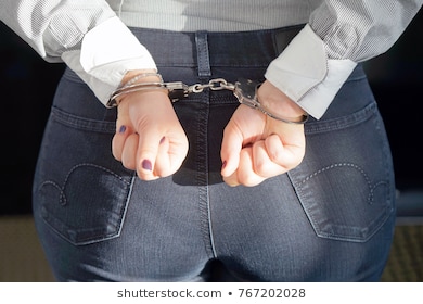 closeup-arrested-woman-handcuffed-hands-260nw-767202028.jpg