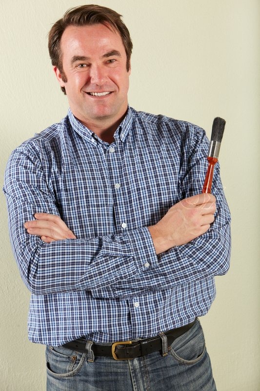 4315362-studio-shot-of-middle-aged-man-holding-paintbrush.jpg